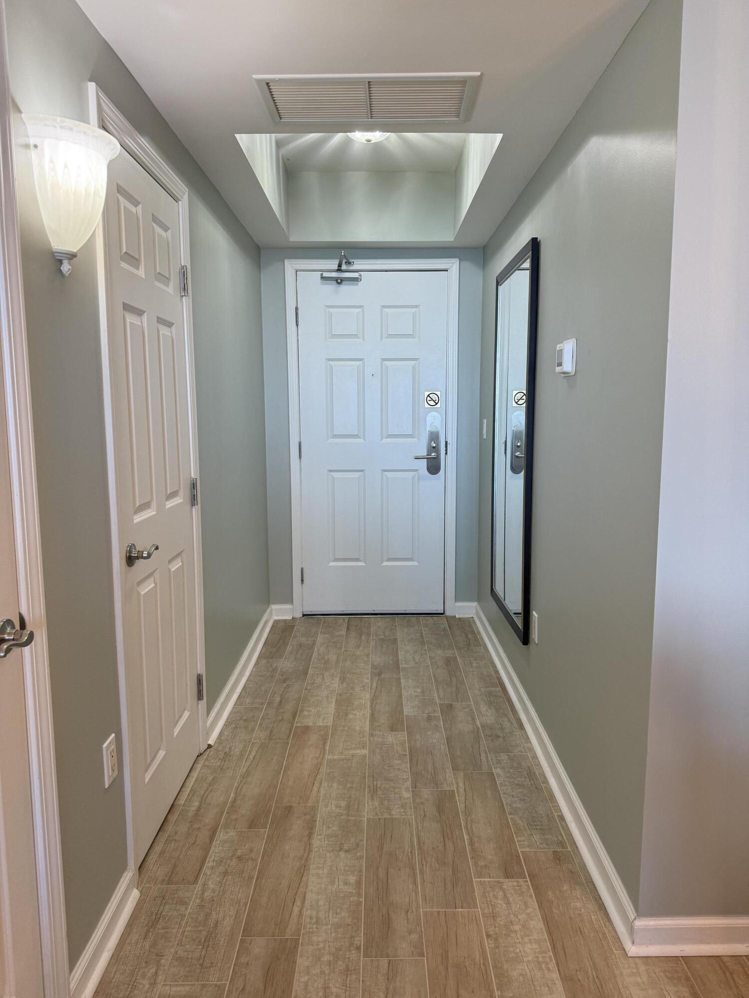 4203 Indian Bayou Trail, Unit 1816 Destin, FL 32541 - Photo 4 of 17 a view of hallway with wooden floor