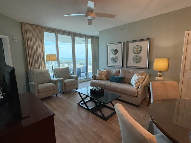 a living room with furniture and a large window