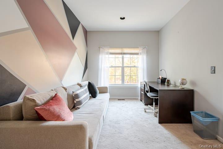 1 Brittany Court Ridge, NY 11961 - Photo 12 of 40 a living room with furniture and a window