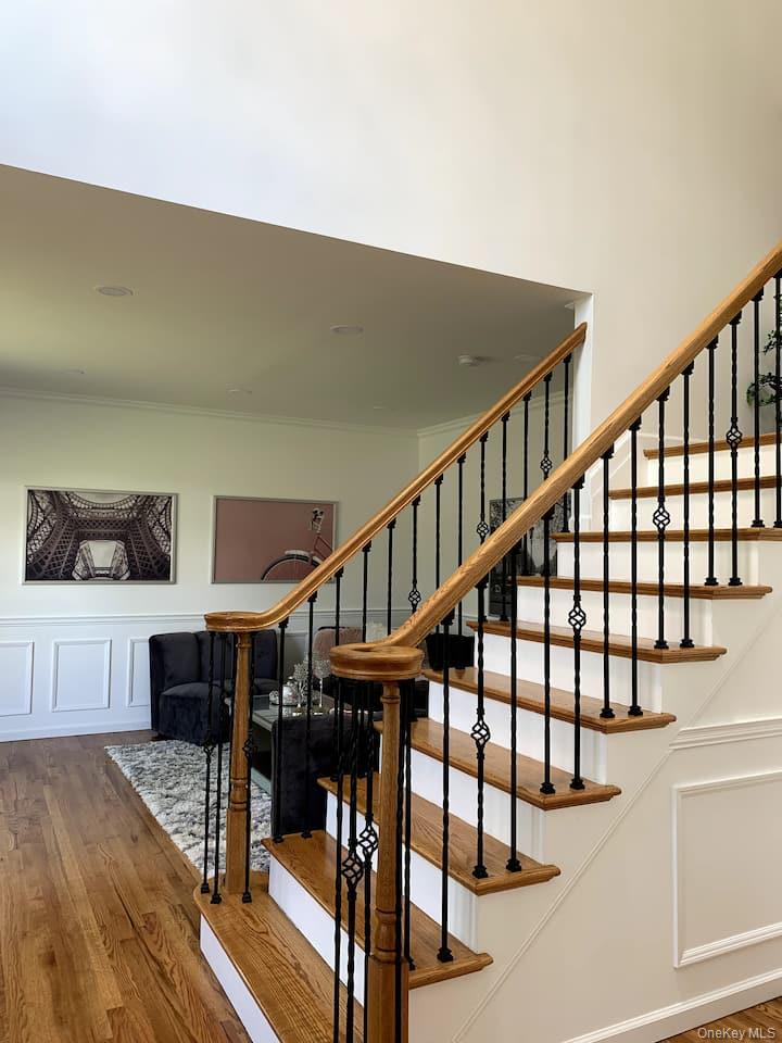 1 Brittany Court Ridge, NY 11961 - Photo 15 of 40 a view of entryway dining room and hall with wooden floor