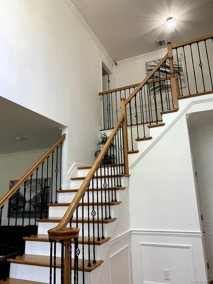 1 Brittany Court Ridge, NY 11961 - Photo 16 of 40 a view of entryway with wooden floor
