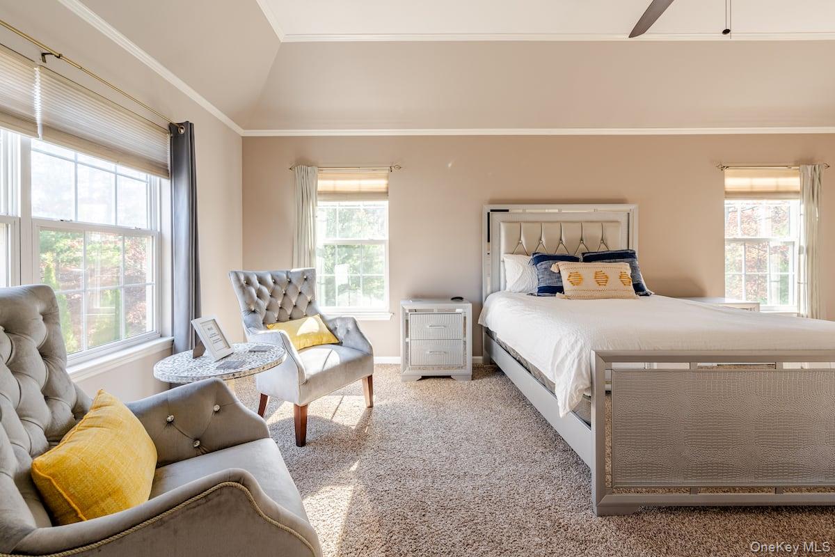 1 Brittany Court Ridge, NY 11961 - Photo 19 of 40 a bed room with a bed and a couch