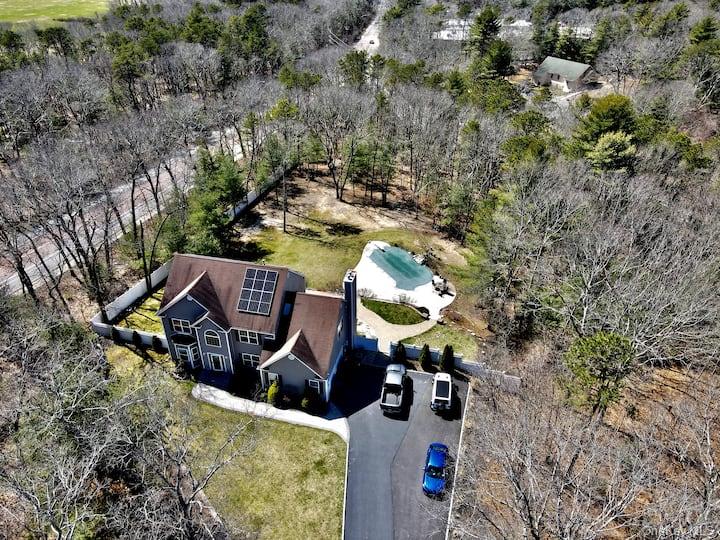 1 Brittany Court Ridge, NY 11961 - Photo 25 of 40 an aerial view of a house with swimming pool and large trees