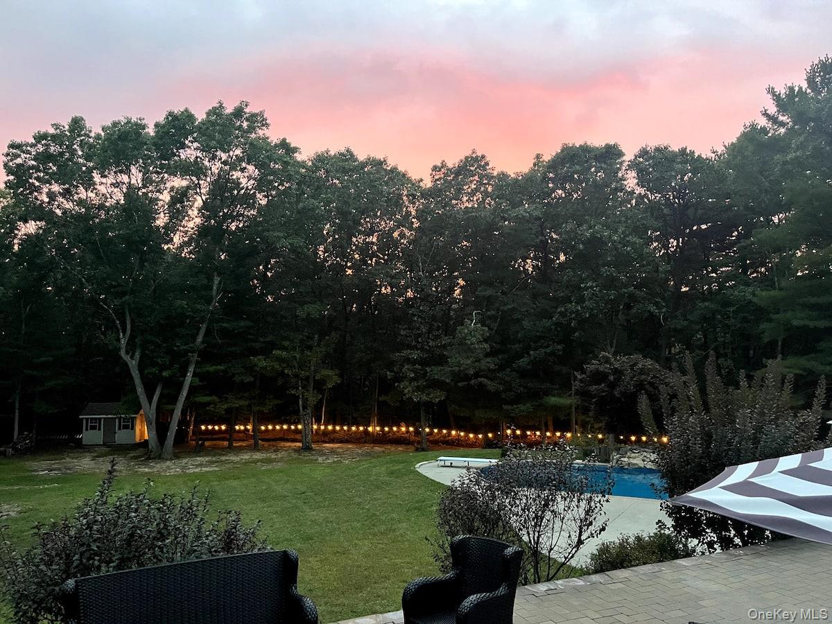 1 Brittany Court Ridge, NY 11961 - Photo 28 of 40 a view of a garden with houses in the background