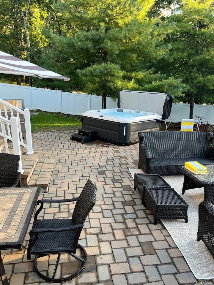 1 Brittany Court Ridge, NY 11961 - Photo 29 of 40 a backyard of a house with barbeque oven table and chairs