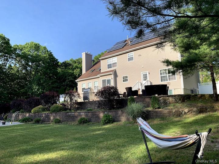 1 Brittany Court Ridge, NY 11961 - Photo 39 of 40 a backyard of a house with seating space