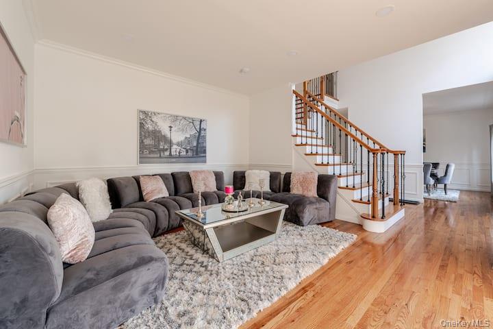1 Brittany Court Ridge, NY 11961 - Photo 4 of 40 a living room with furniture and a wooden floor