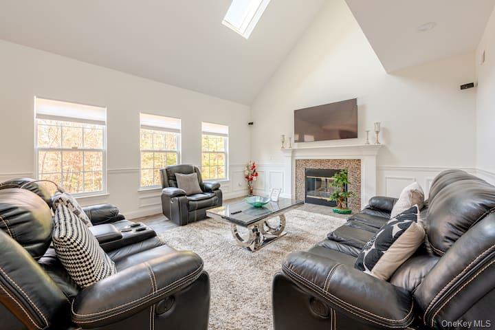 1 Brittany Court Ridge, NY 11961 - Photo 8 of 40 a living room with furniture or fireplace and a large window