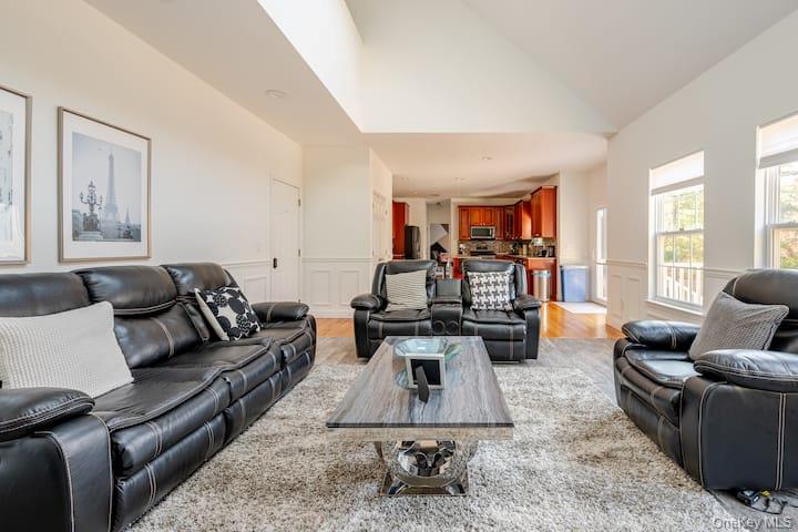 1 Brittany Court Ridge, NY 11961 - Photo 9 of 40 a living room with furniture and a large window