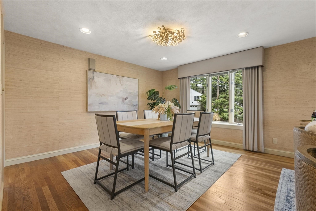 94 Ridge Street Arlington, MA 02474 - Photo 8 of 35 a dining room with furniture a rug and wooden floor