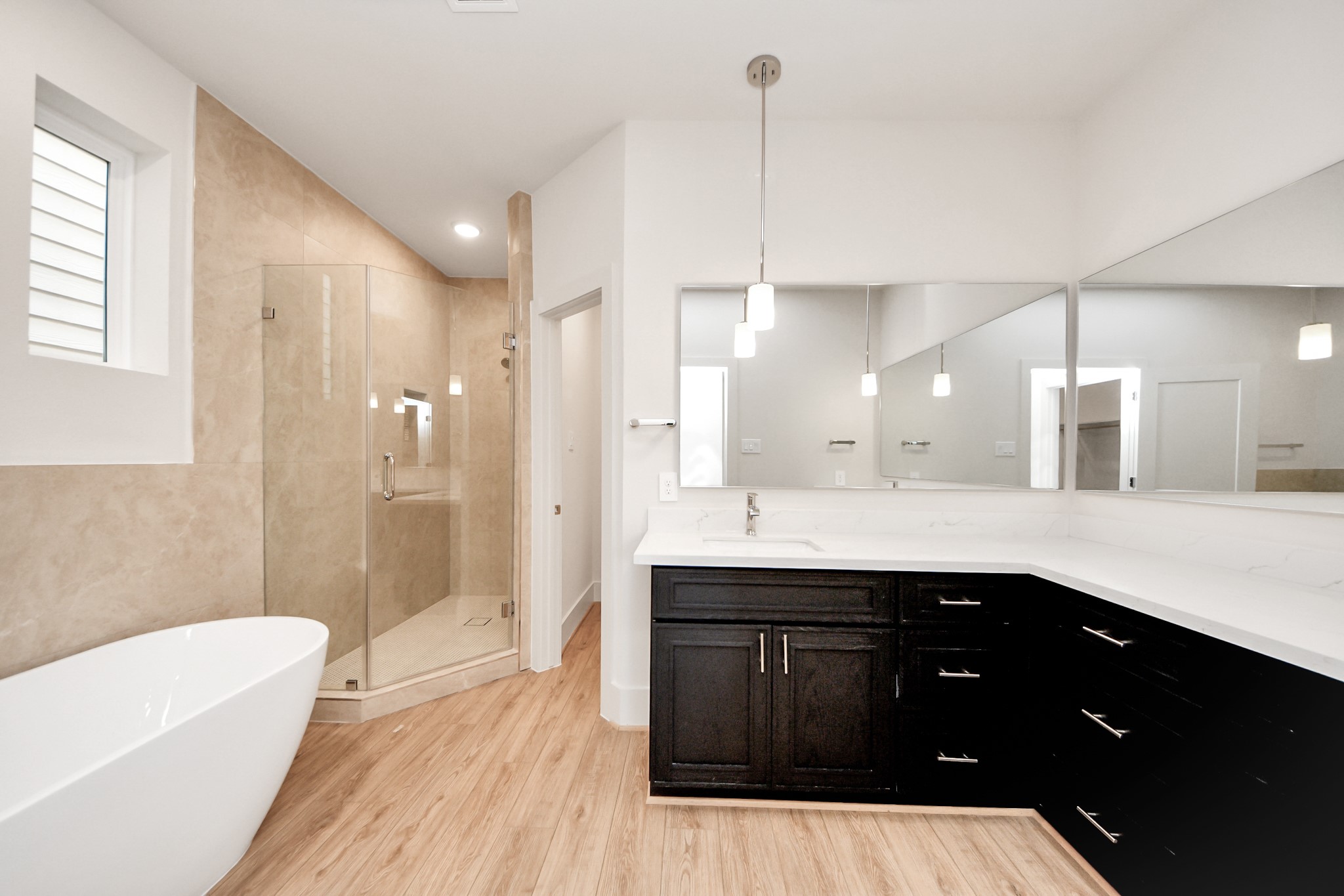 5903 Urban Pines Street Houston, TX 77091 - Photo 40 of 42 a spacious bathroom with a tub sink shower and mirror