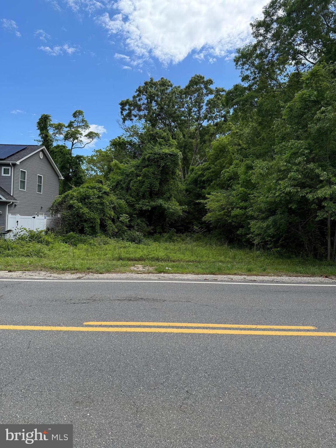 67 Gunning River Road Barnegat, NJ 08005 - Photo 2 of 3 a view of a houses with a yard