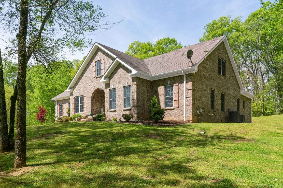 2099 Double Branch Road Columbia, TN 38401 - Photo 3 of 43 a front view of a house with a yard