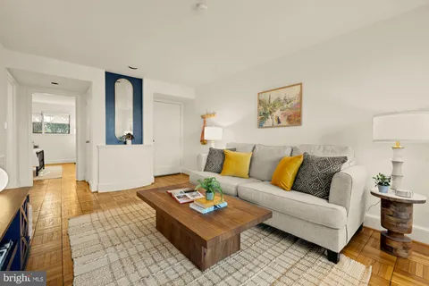 a living room with furniture and a table