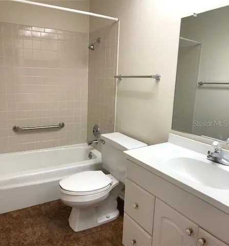 a bathroom with a sink a toilet and a bathtub