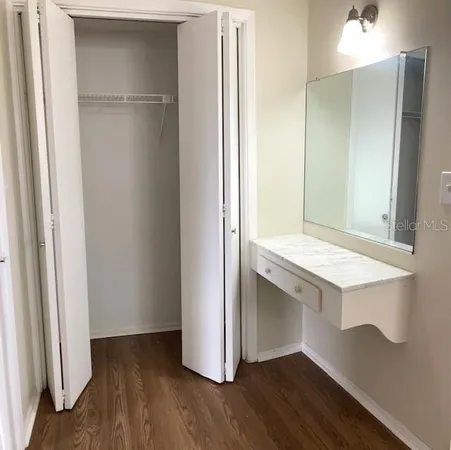 a view of cabinets and wooden floor