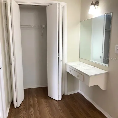 a view of cabinets and wooden floor
