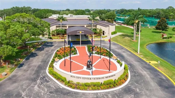 an aerial view of a house with a swimming pool yard and outdoor seating