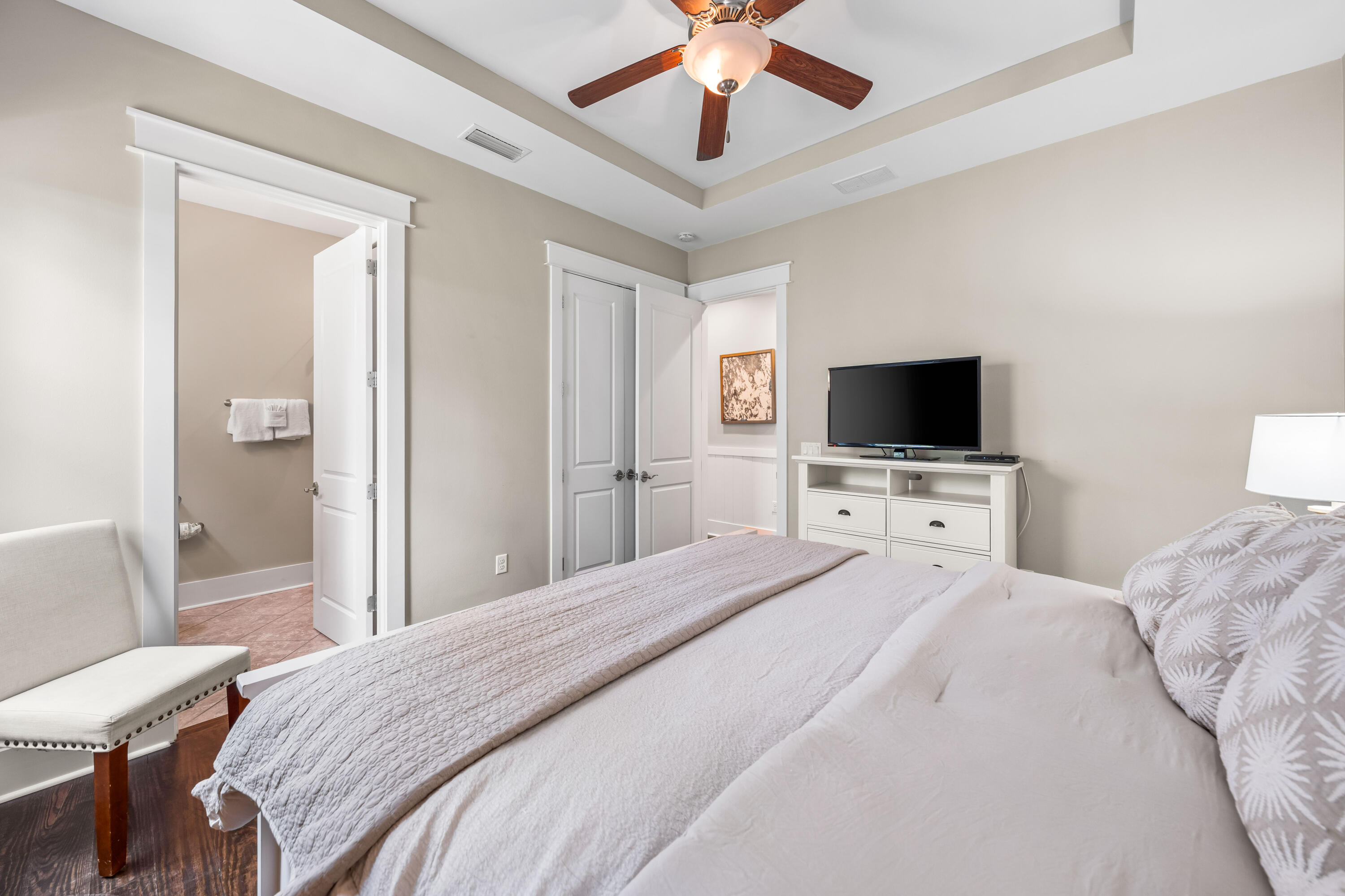 979 Sandgrass Boulevard Santa Rosa Beach, FL 32459 - Photo 17 of 72 a bedroom with a bed and a flat screen tv