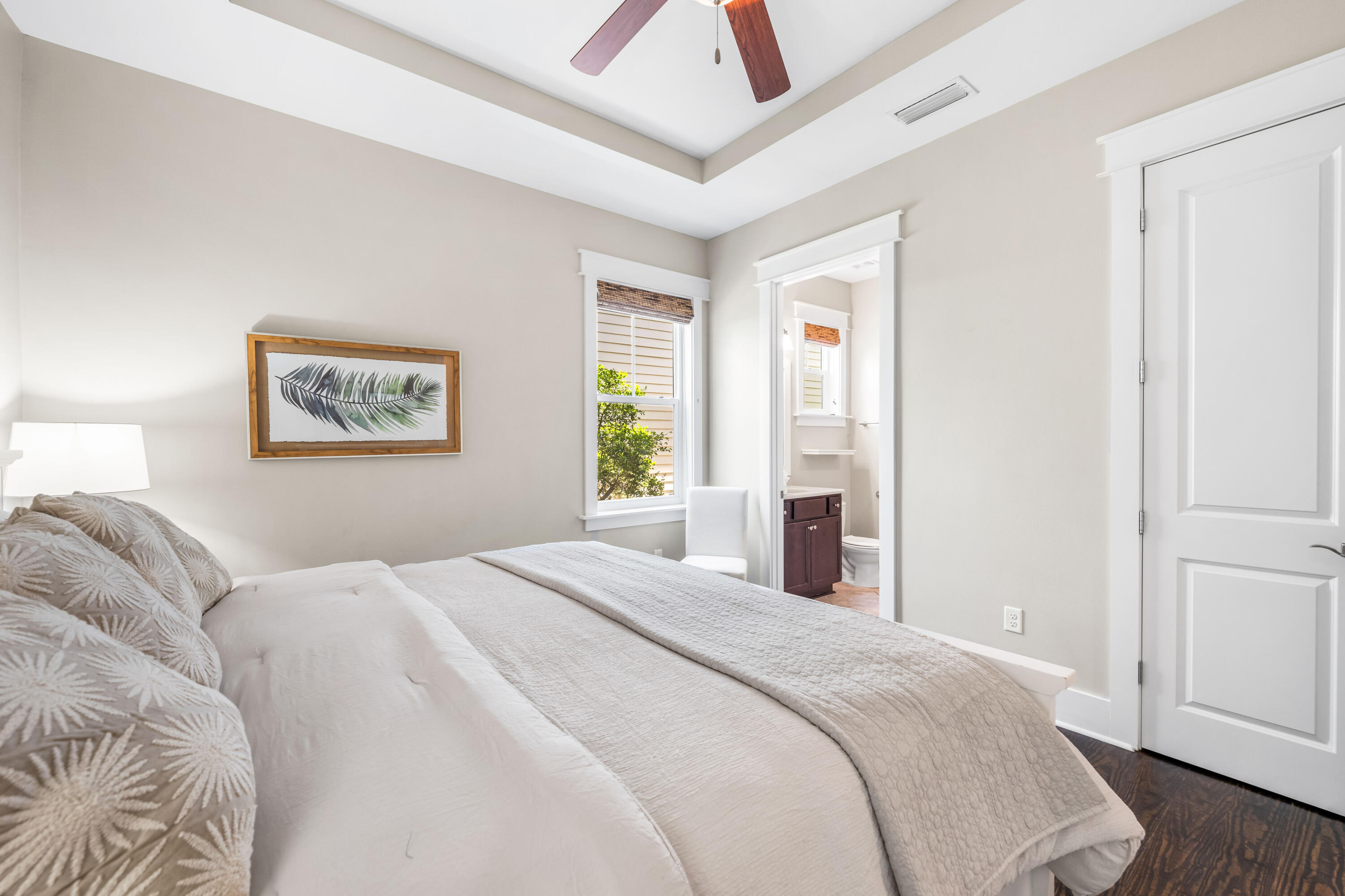 979 Sandgrass Boulevard Santa Rosa Beach, FL 32459 - Photo 18 of 72 a bedroom with a large bed and a chandelier