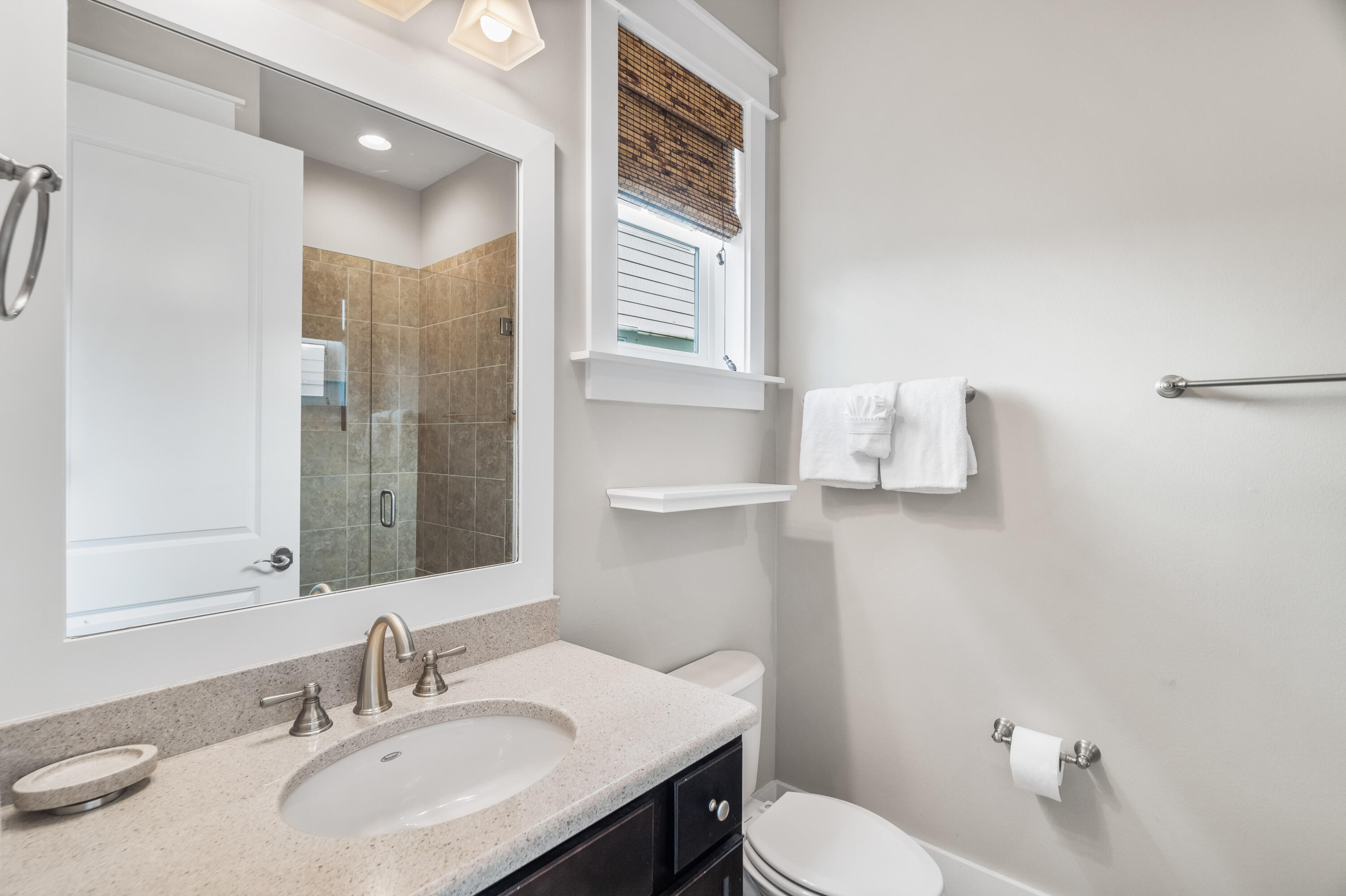 979 Sandgrass Boulevard Santa Rosa Beach, FL 32459 - Photo 19 of 72 a bathroom with a sink toilet and mirror
