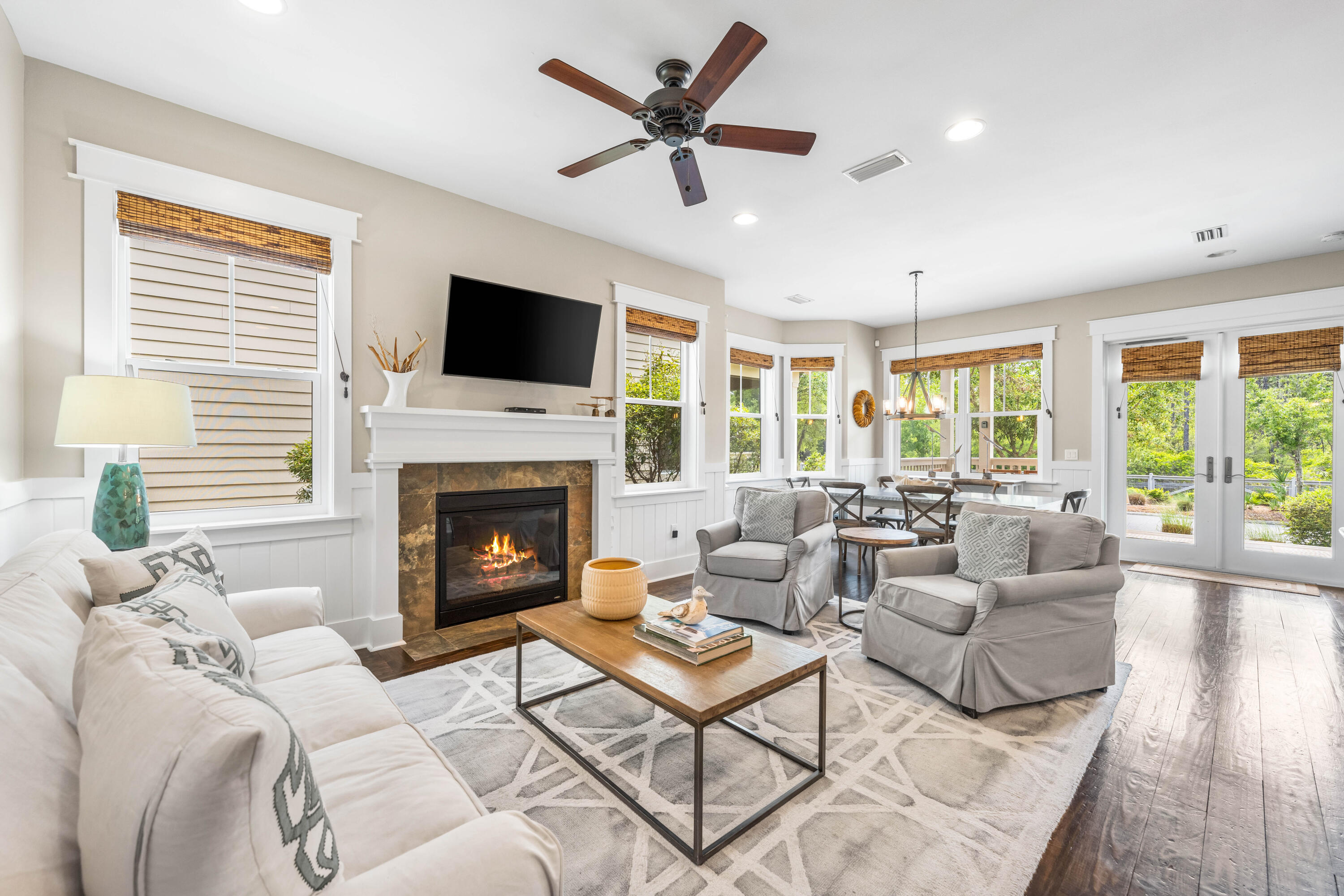 979 Sandgrass Boulevard Santa Rosa Beach, FL 32459 - Photo 2 of 72 a living room with furniture fireplace and a large window