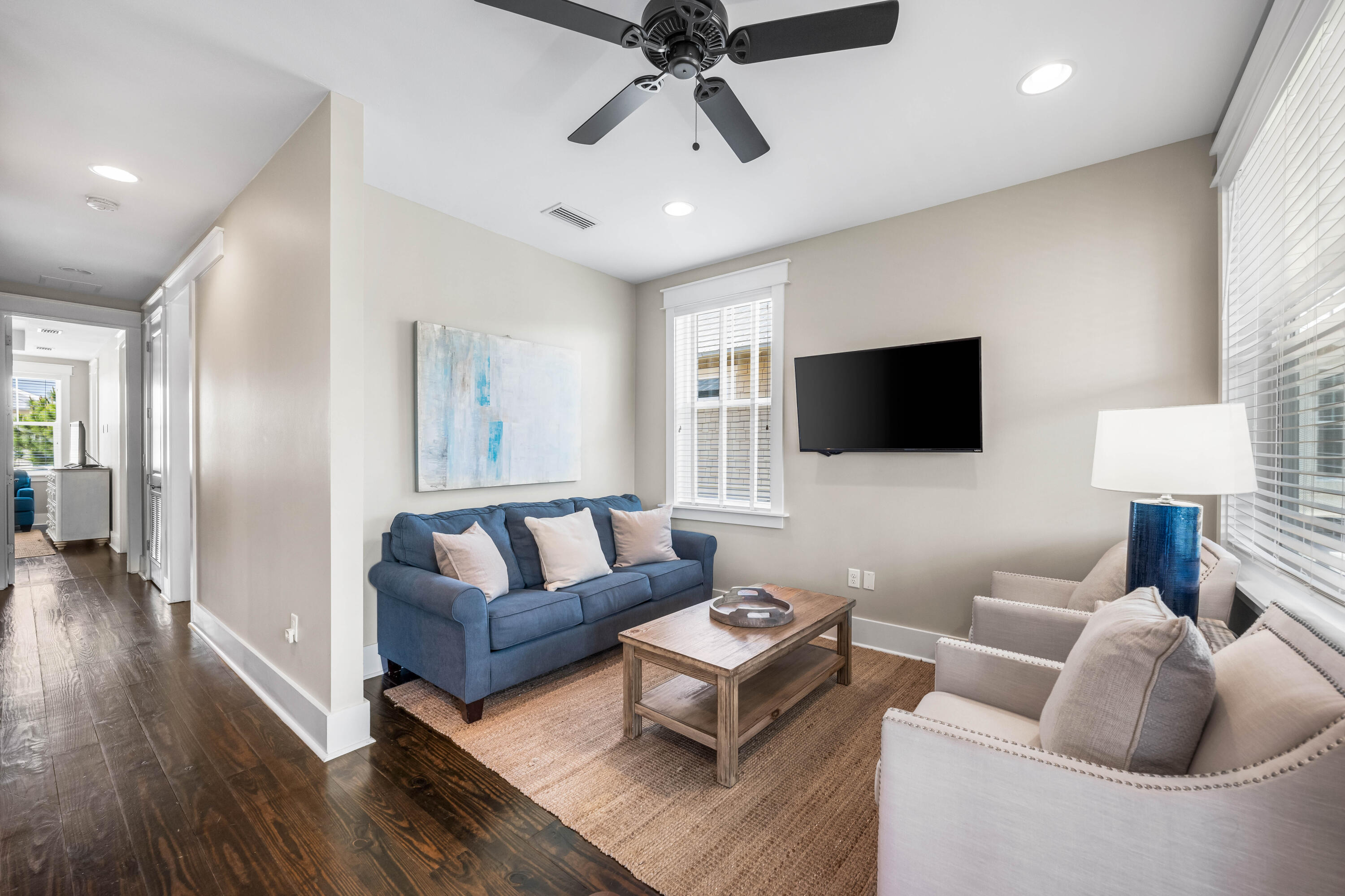 979 Sandgrass Boulevard Santa Rosa Beach, FL 32459 - Photo 22 of 72 a living room with furniture and a flat screen tv