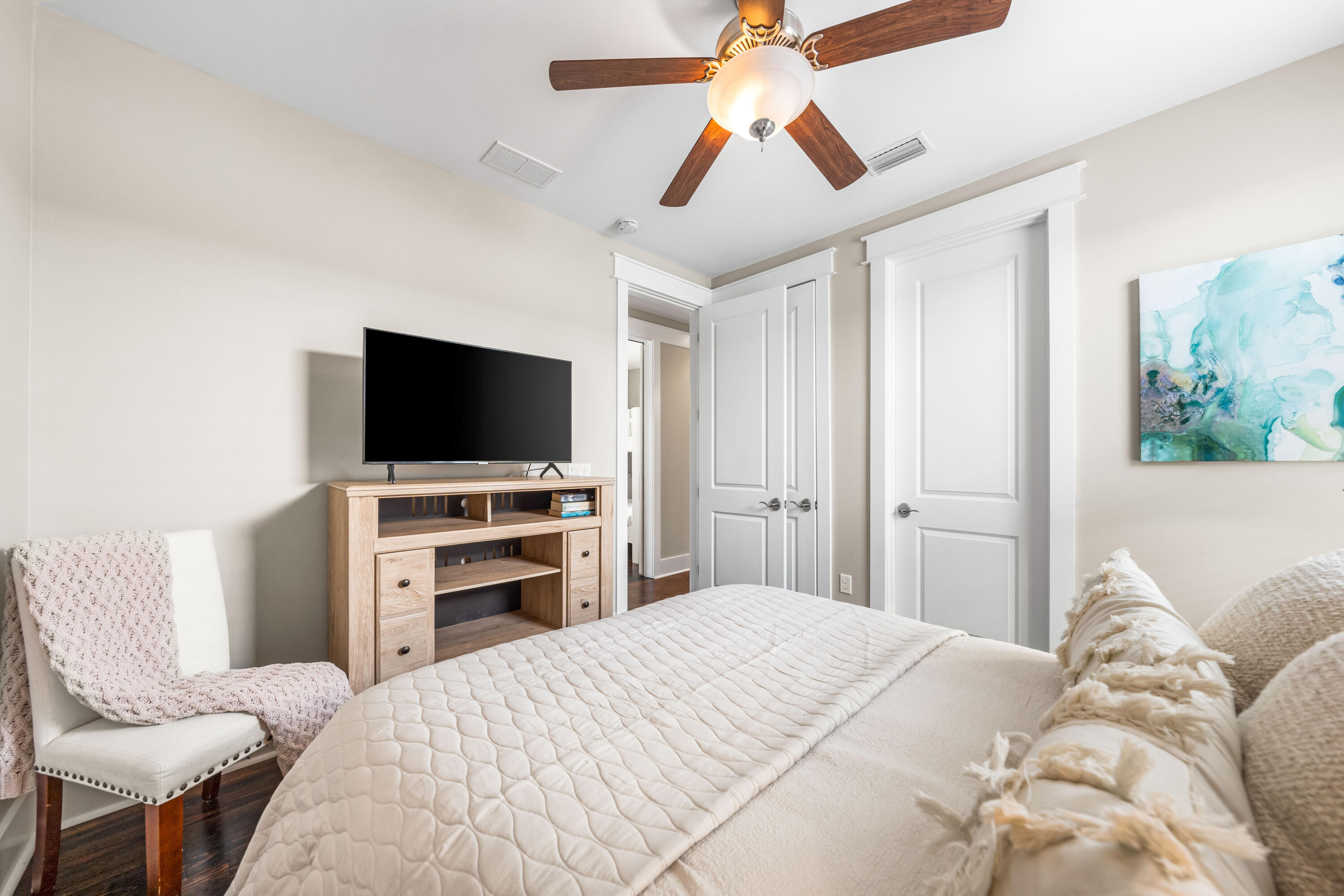 979 Sandgrass Boulevard Santa Rosa Beach, FL 32459 - Photo 29 of 72 a bedroom with a bed and a flat screen tv