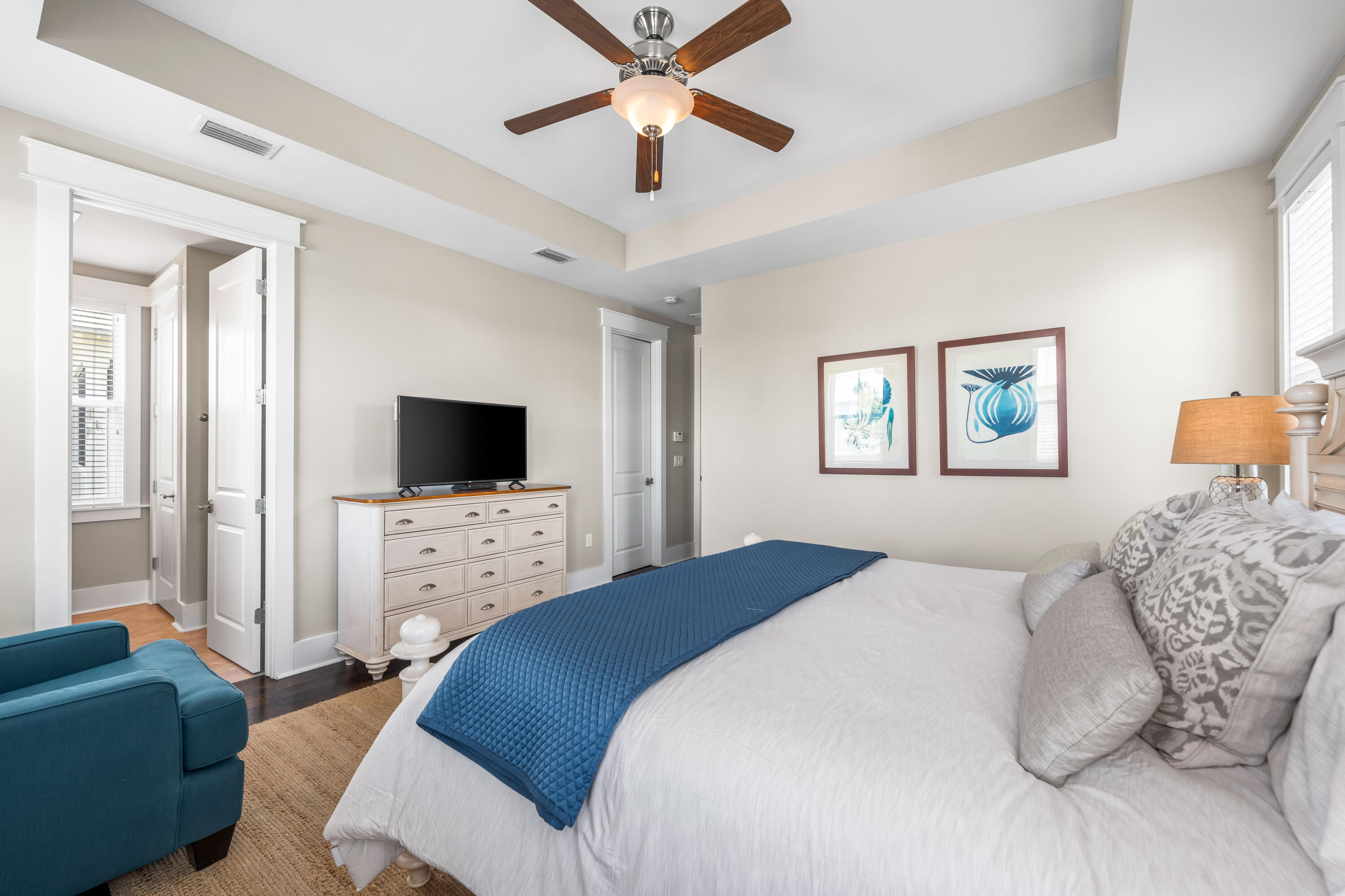 979 Sandgrass Boulevard Santa Rosa Beach, FL 32459 - Photo 34 of 72 a bedroom with a bed a couch and a flat screen tv