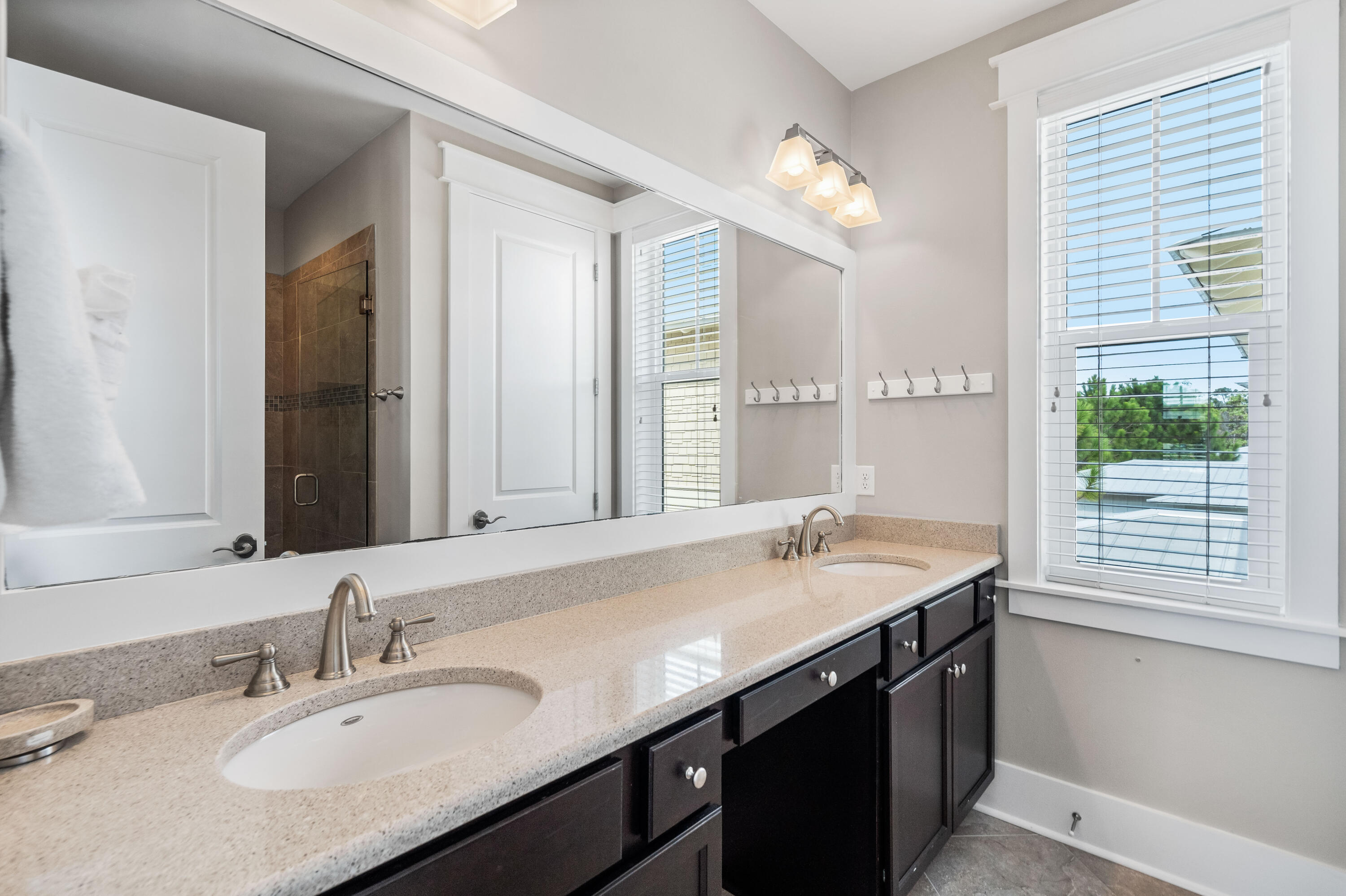 979 Sandgrass Boulevard Santa Rosa Beach, FL 32459 - Photo 35 of 72 a bathroom with a sink double vanity and a mirror