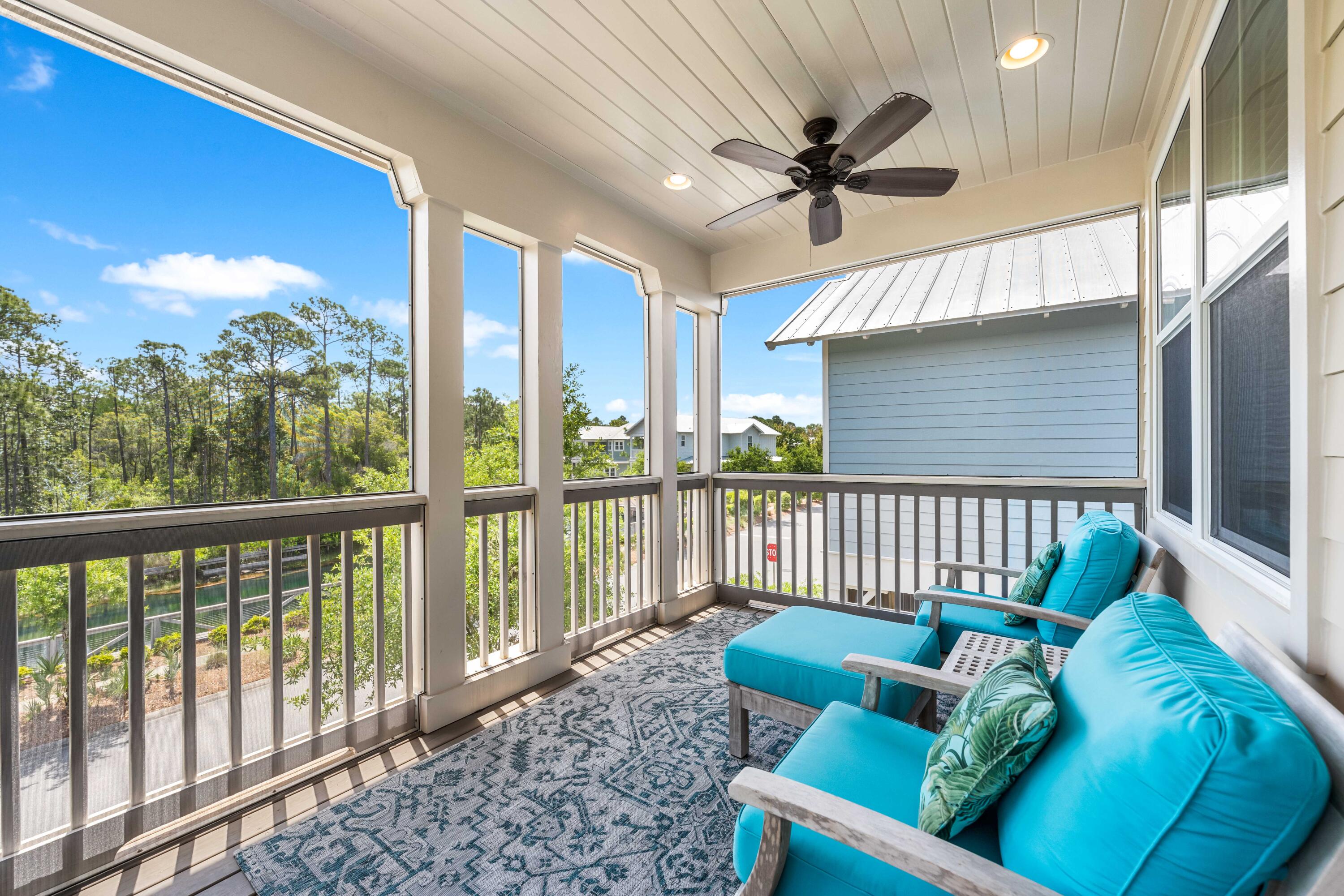 979 Sandgrass Boulevard Santa Rosa Beach, FL 32459 - Photo 39 of 72 a view of a porch with furniture