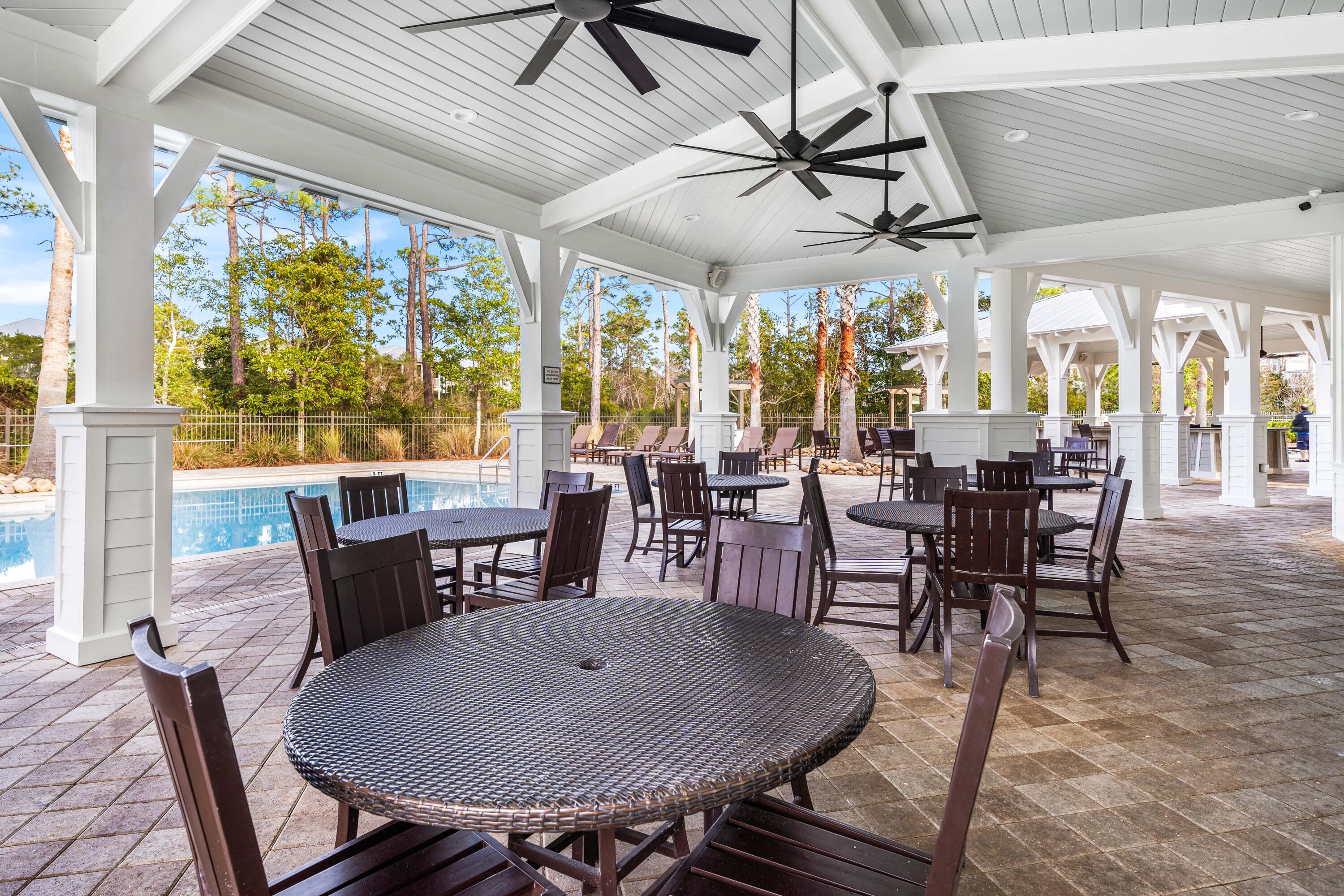 979 Sandgrass Boulevard Santa Rosa Beach, FL 32459 - Photo 58 of 72 a view of a dining room with furniture window and outside view