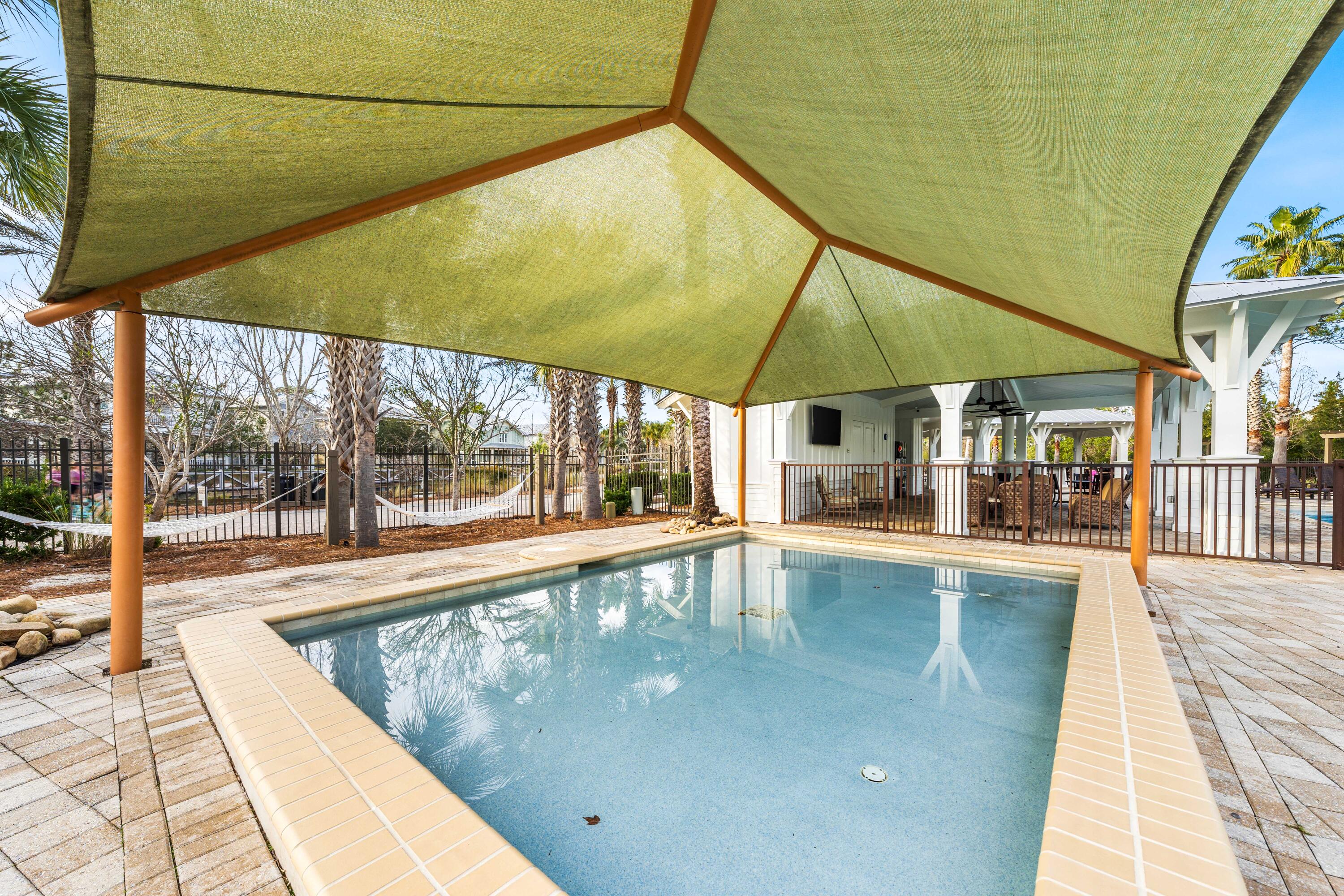 979 Sandgrass Boulevard Santa Rosa Beach, FL 32459 - Photo 59 of 72 a view of a swimming pool with a porch
