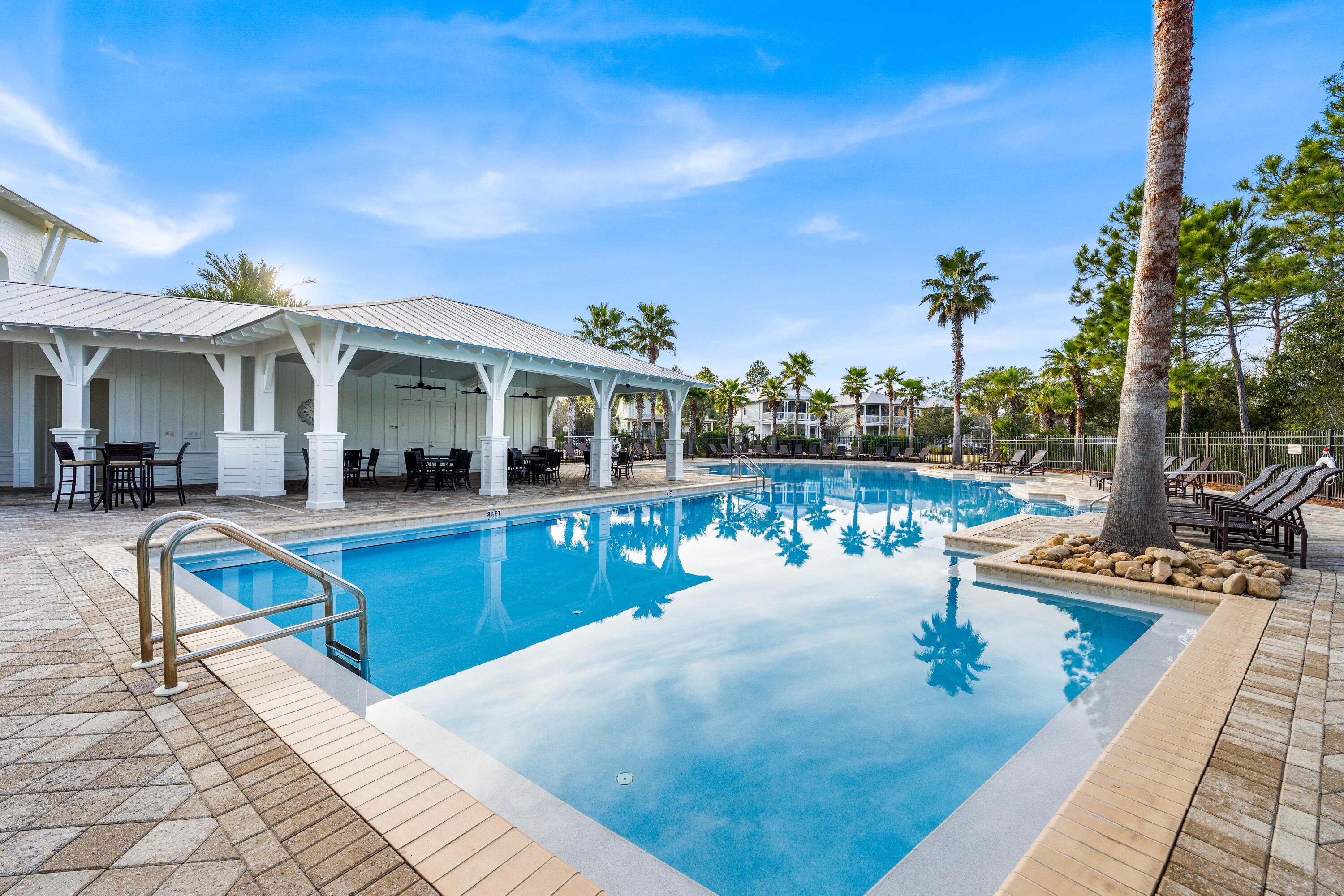 979 Sandgrass Boulevard Santa Rosa Beach, FL 32459 - Photo 69 of 72 a view of a swimming pool with outdoor seating