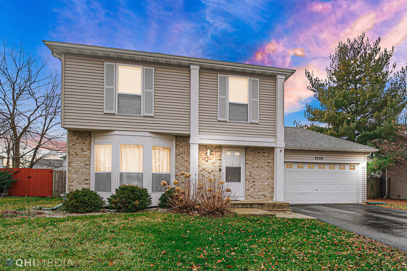 3208 Old Castle Road Joliet, IL 60431 - Photo 1 of 19 a front view of a house with garden