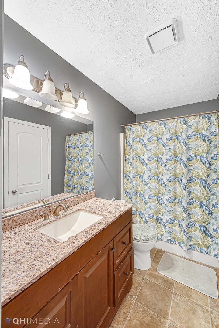 3208 Old Castle Road Joliet, IL 60431 - Photo 13 of 19 a bathroom with a granite countertop sink and a mirror