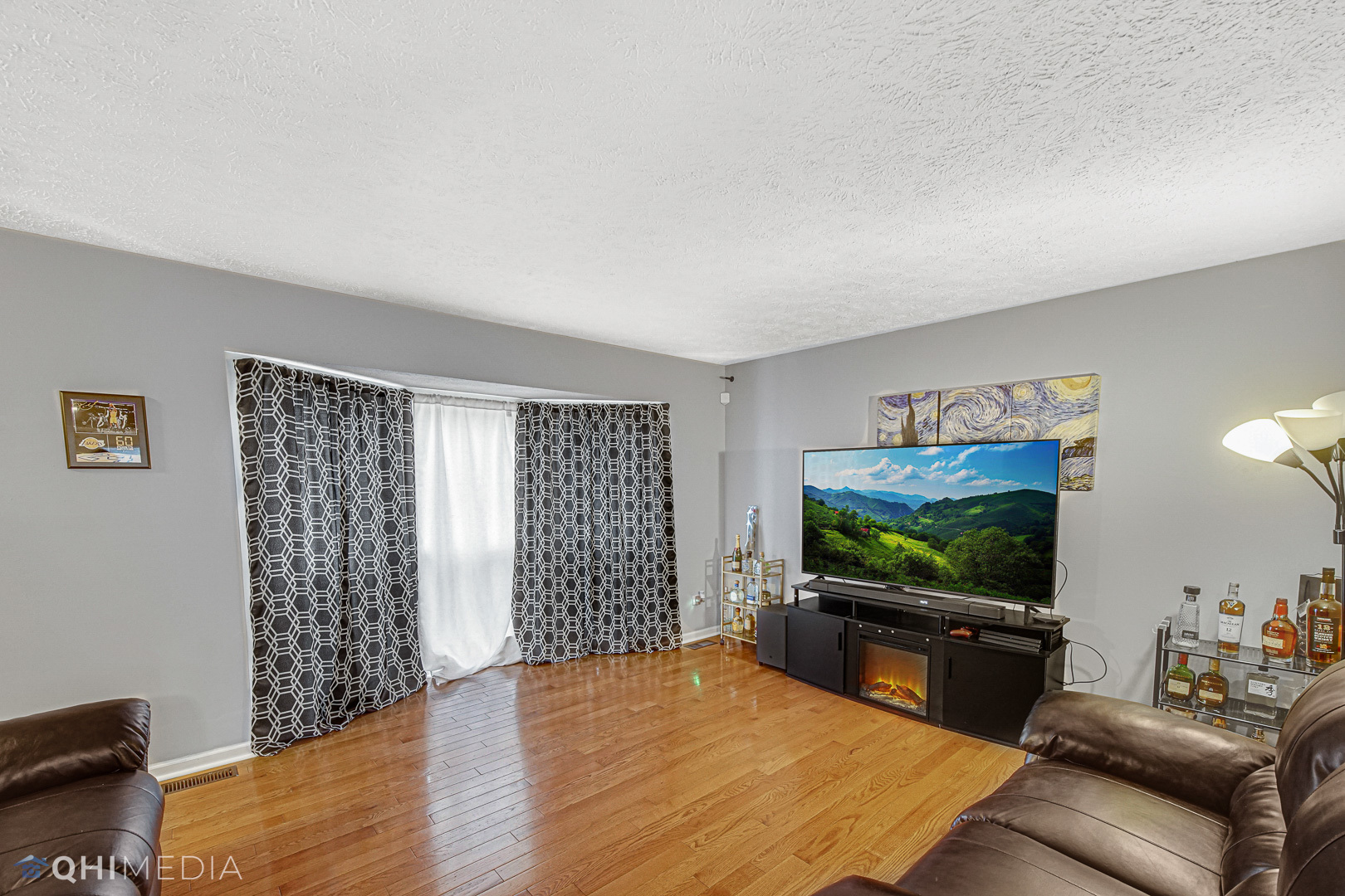 3208 Old Castle Road Joliet, IL 60431 - Photo 2 of 19 a living room with furniture and a flat screen tv