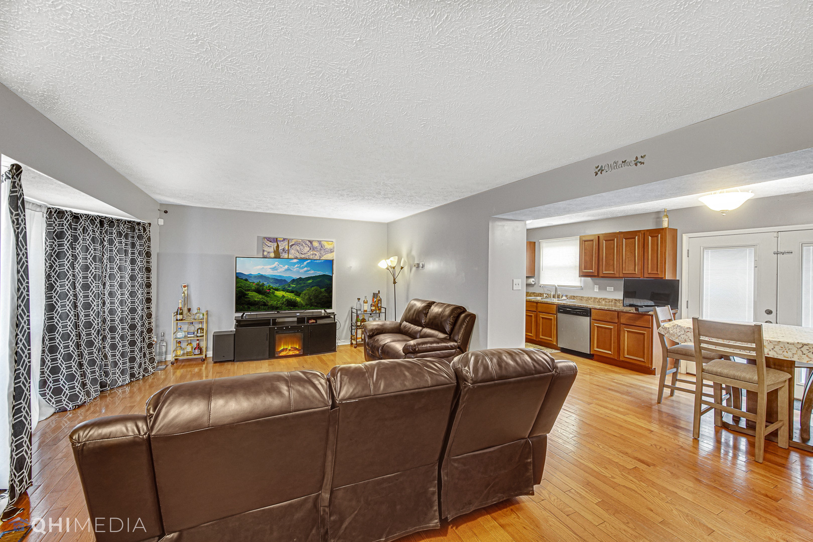 3208 Old Castle Road Joliet, IL 60431 - Photo 3 of 19 a living room with furniture and a flat screen tv