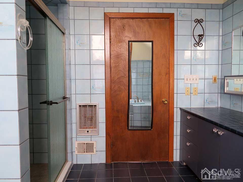 1818 Oak Tree Road Edison, NJ 08820 - Photo 21 of 25 a bathroom with a shower and a sink