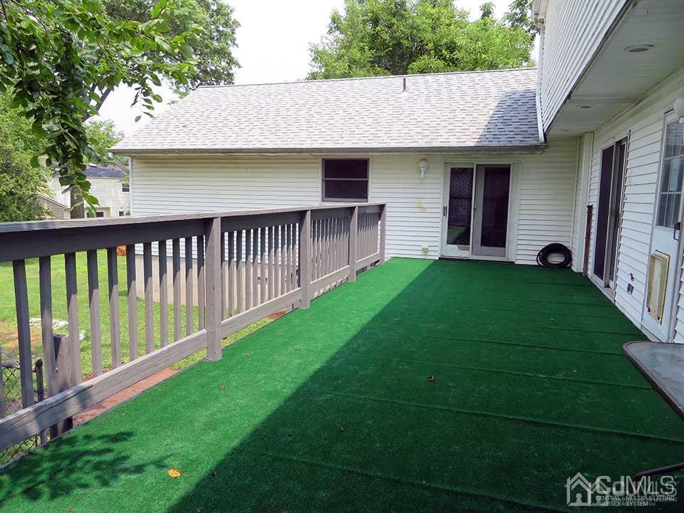 1818 Oak Tree Road Edison, NJ 08820 - Photo 24 of 25 a view of a house with a backyard and a patio