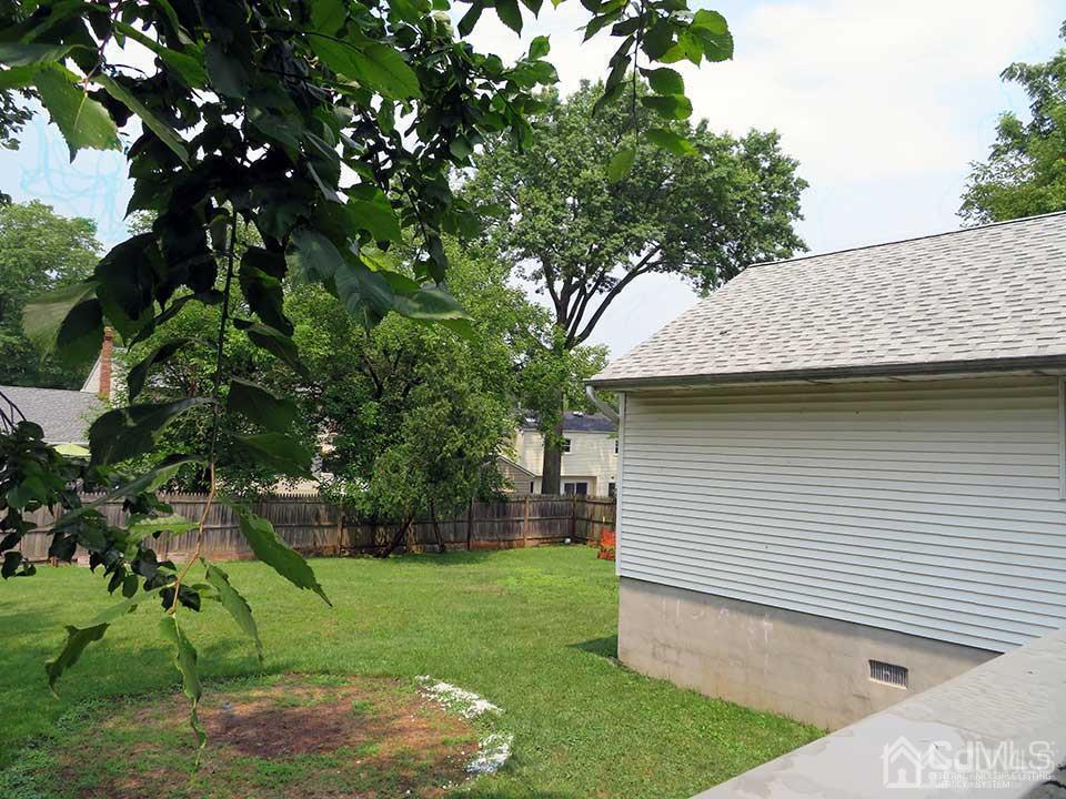 1818 Oak Tree Road Edison, NJ 08820 - Photo 25 of 25 a view of a backyard with a tree