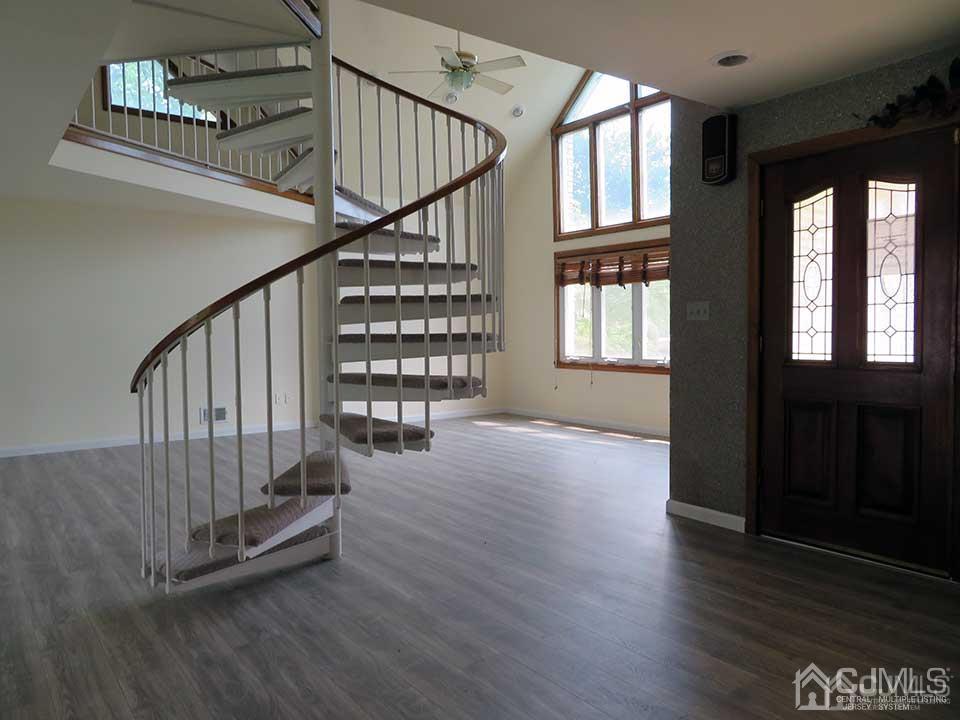 1818 Oak Tree Road Edison, NJ 08820 - Photo 3 of 25 an empty room with wooden floor and windows