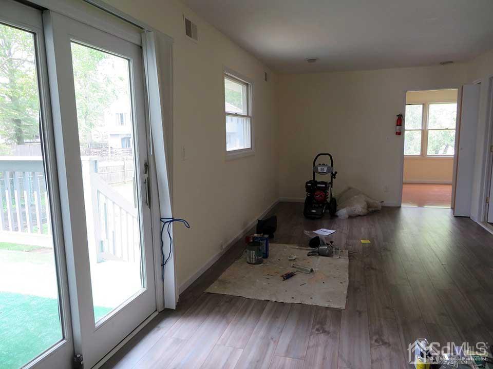 1818 Oak Tree Road Edison, NJ 08820 - Photo 10 of 25 a room with wooden floor and a window