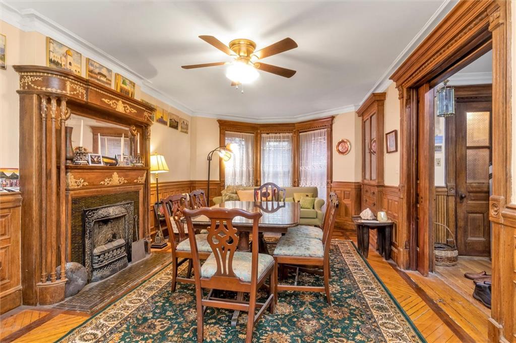 264 Decatur Street Brooklyn, NY 11233 - Photo 12 of 27 a dining room with furniture a chandelier and a rug