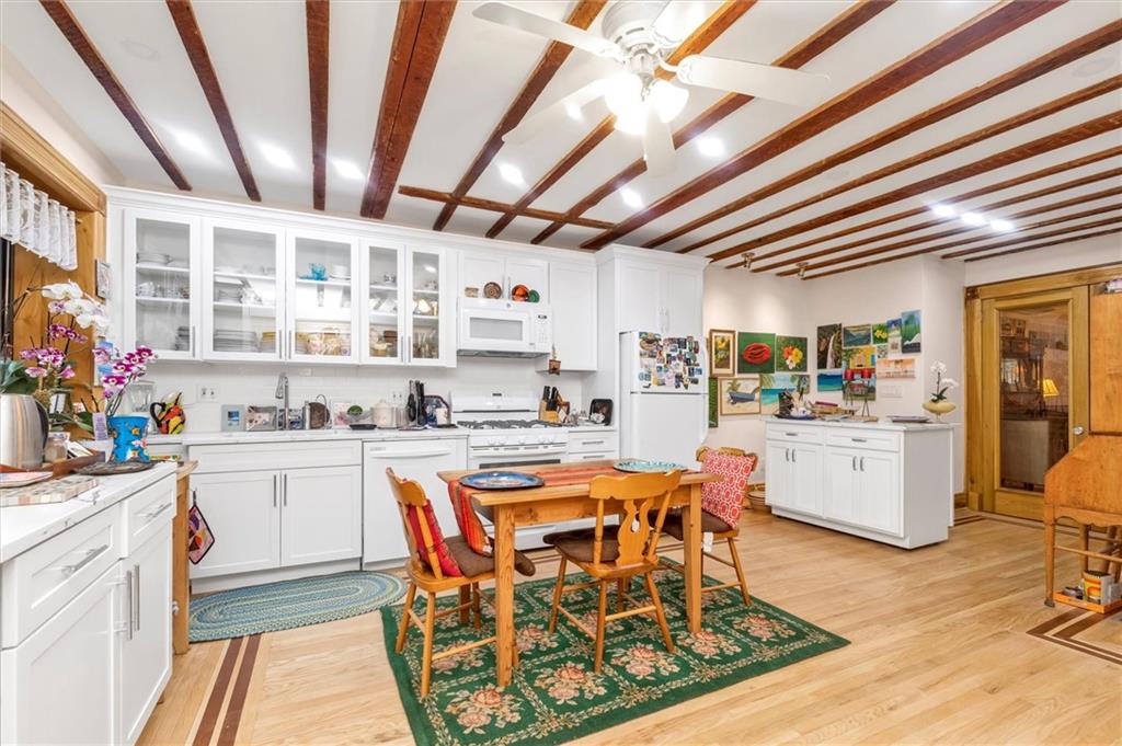 264 Decatur Street Brooklyn, NY 11233 - Photo 14 of 27 a living room with stainless steel appliances kitchen island granite countertop furniture and a kitchen view