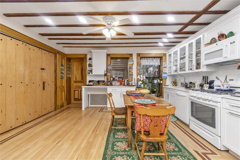 264 Decatur Street Brooklyn, NY 11233 - Photo 16 of 27 a kitchen with stainless steel appliances granite countertop a stove and cabinets