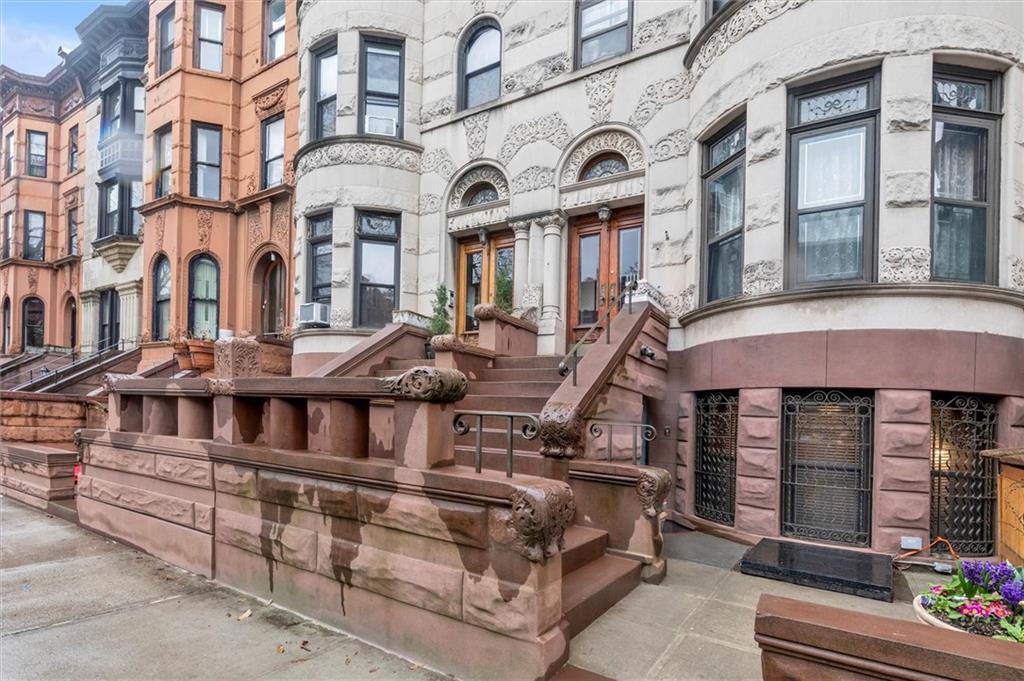 264 Decatur Street Brooklyn, NY 11233 - Photo 26 of 27 a front view of a building with glass windows