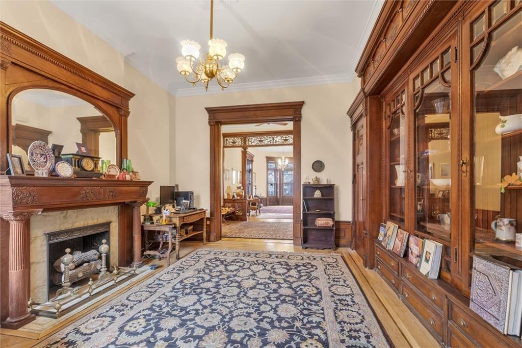 264 Decatur Street Brooklyn, NY 11233 - Photo 8 of 27 a living room with furniture and a fireplace