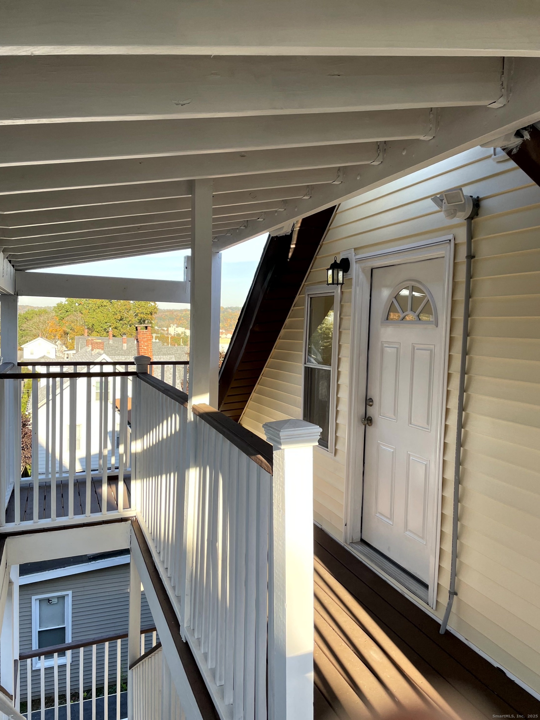 39 Elm Street Shelton, CT 06484 - Photo 7 of 8 a view of a balcony with wooden floor
