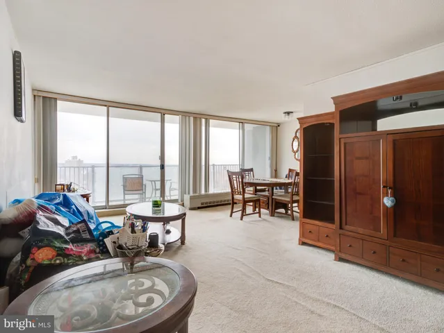 a very nice looking living room with furniture and a large window